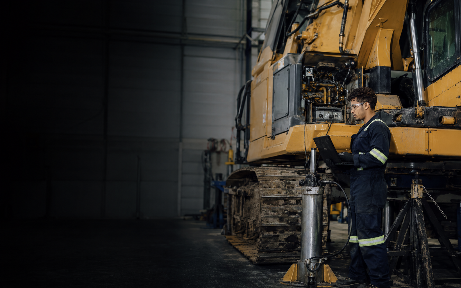 Heavy Duty Equipment Technician working safely in a representative workplace